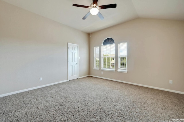 unfurnished room featuring ceiling fan, lofted ceiling, and carpet floors