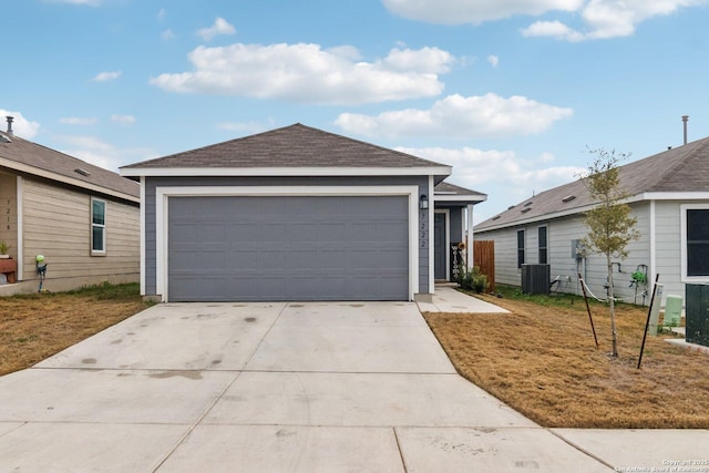 ranch-style home featuring a garage and central AC