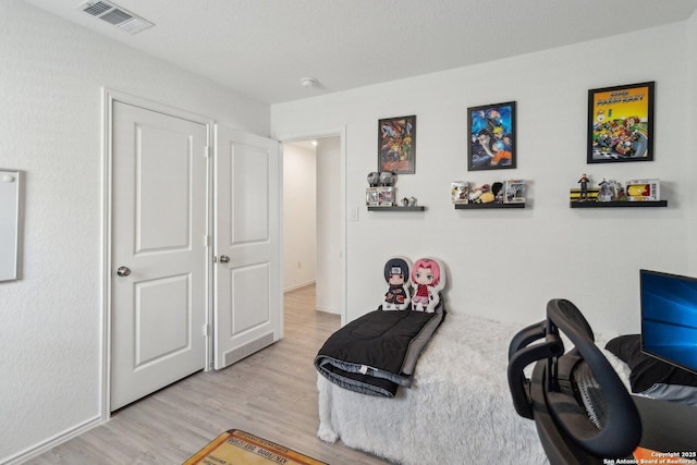 bedroom with light hardwood / wood-style floors