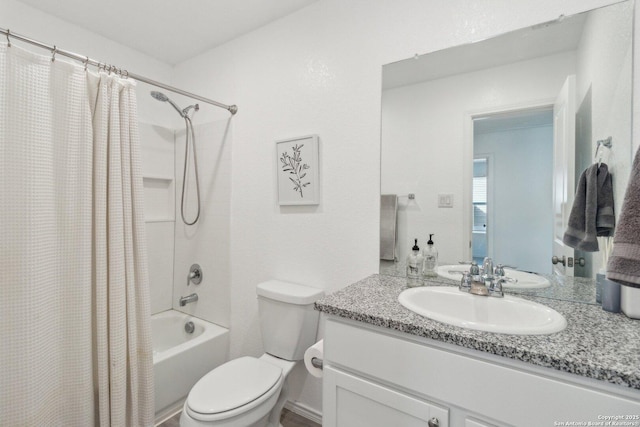 full bathroom featuring vanity, toilet, and shower / bath combo with shower curtain