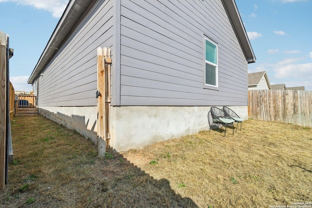 view of home's exterior with a yard