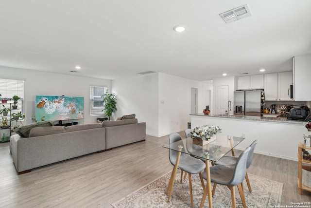 dining room featuring light hardwood / wood-style floors