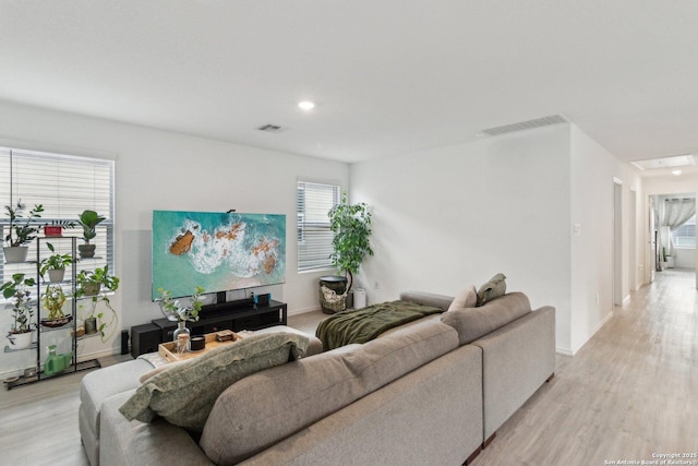 living room with light hardwood / wood-style flooring