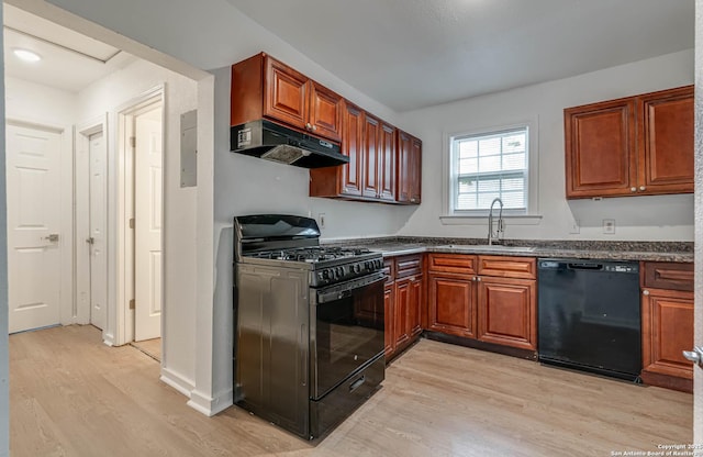 kitchen with sink, light hardwood / wood-style floors, and black appliances