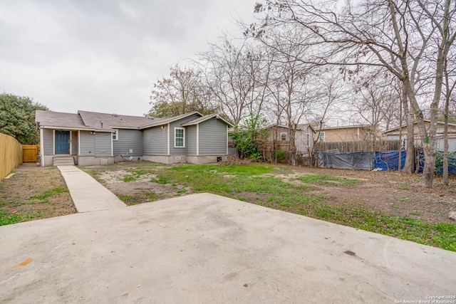 back of property with a patio