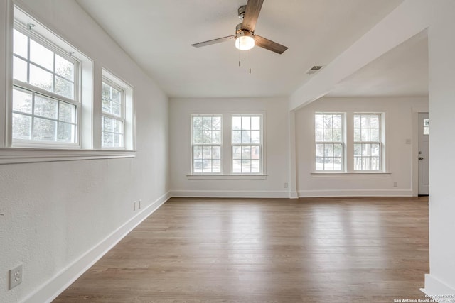 unfurnished room featuring light hardwood / wood-style flooring and ceiling fan