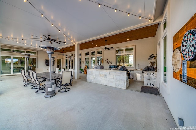 view of patio / terrace featuring area for grilling, sink, and ceiling fan