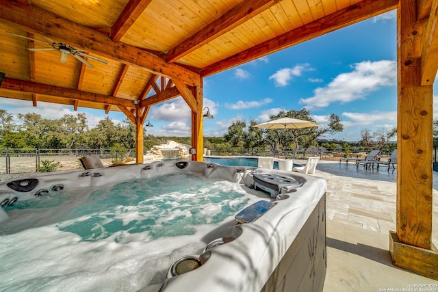 view of patio / terrace with a hot tub