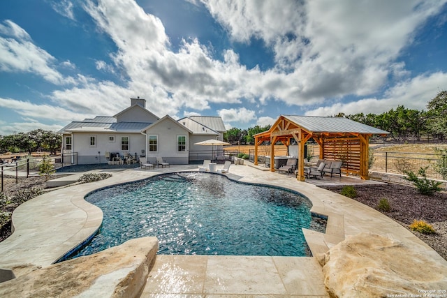 view of swimming pool with an outdoor living space, a gazebo, and a patio