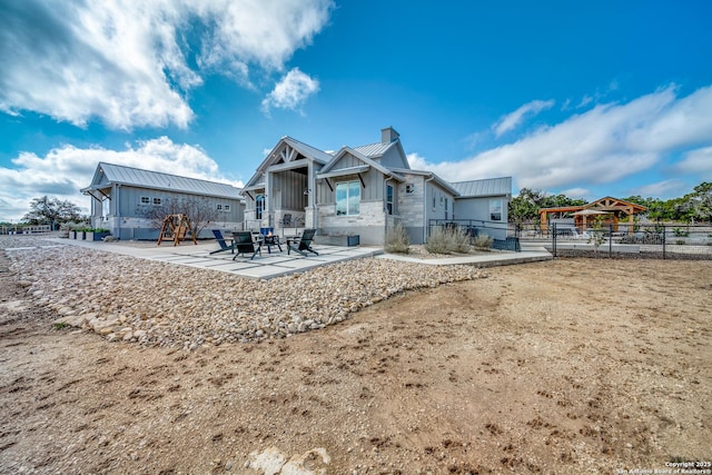 rear view of house featuring a patio