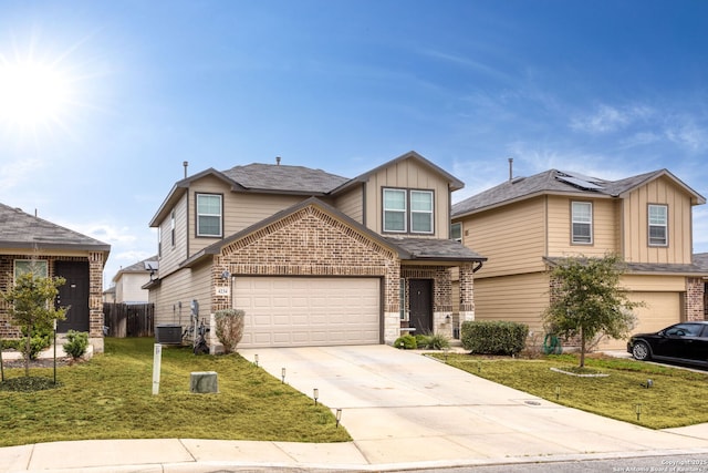 view of front of property featuring central AC unit, a garage, and a front yard