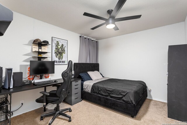 bedroom with light carpet and ceiling fan