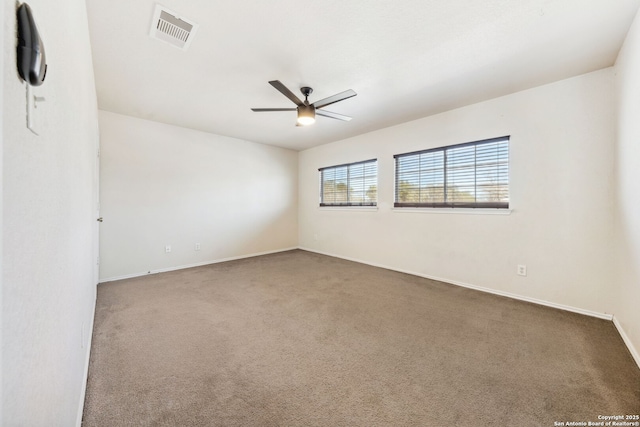 carpeted empty room with ceiling fan