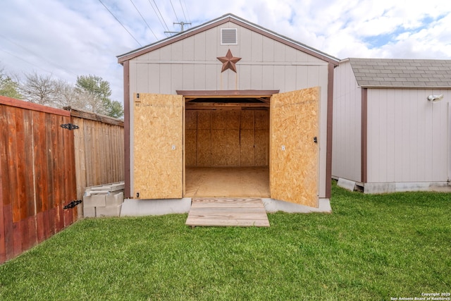 view of outbuilding with a yard