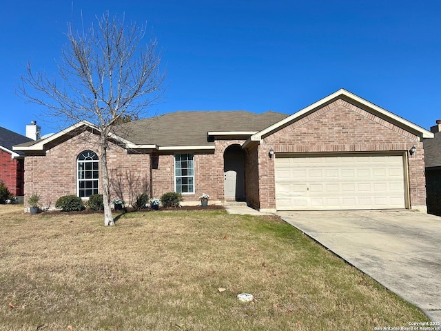 ranch-style home with a garage and a front lawn