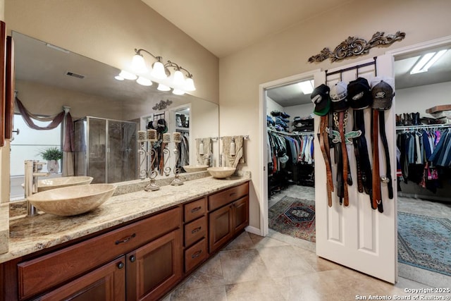 bathroom with vanity and an enclosed shower