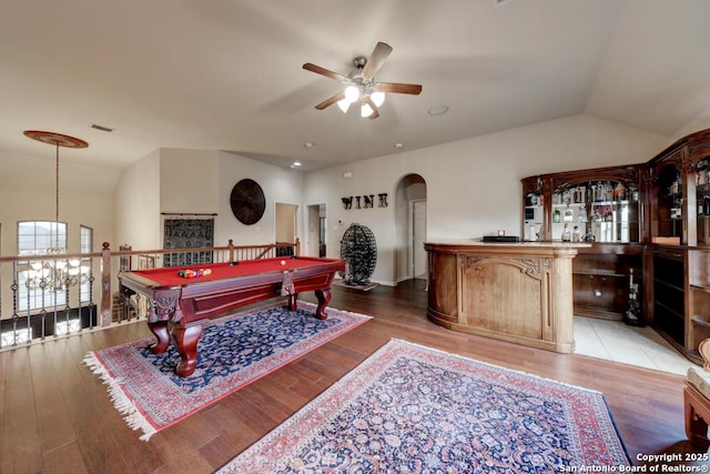 game room featuring wood-type flooring, ceiling fan, and vaulted ceiling