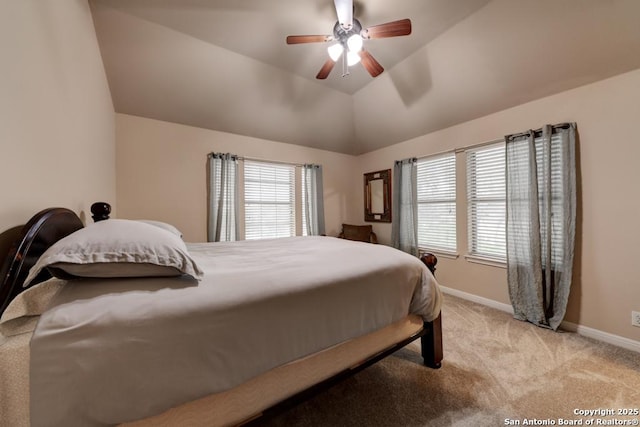 bedroom with vaulted ceiling, light carpet, and ceiling fan