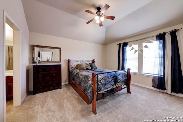 carpeted bedroom with ceiling fan and vaulted ceiling