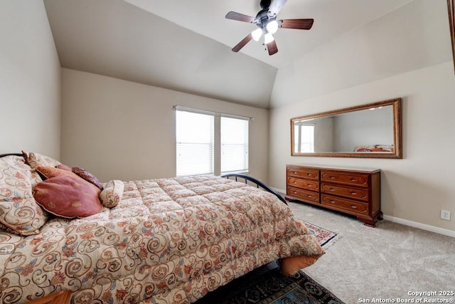 carpeted bedroom featuring ceiling fan and lofted ceiling