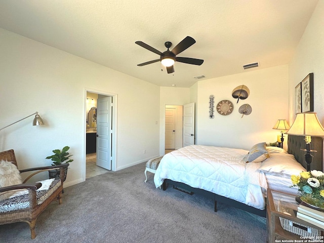 bedroom with ensuite bathroom, carpet, and ceiling fan