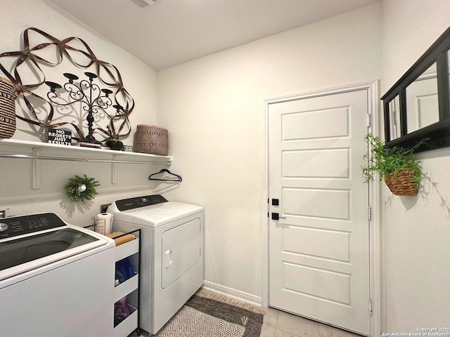 washroom with washer and dryer