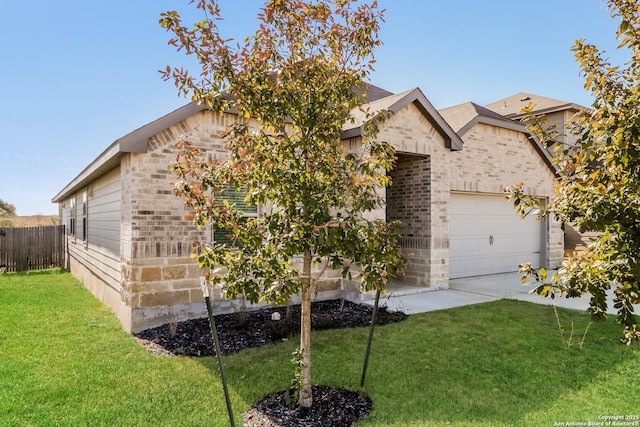 view of front of property with a garage and a front yard