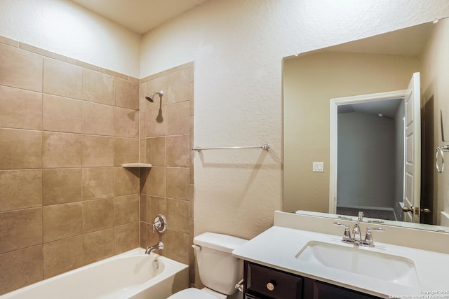 full bathroom featuring tiled shower / bath combo, vanity, and toilet