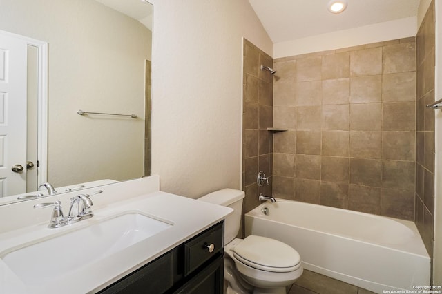 full bathroom with vanity, toilet, tiled shower / bath combo, and tile patterned flooring