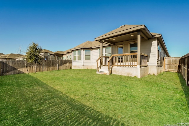 rear view of house with a lawn