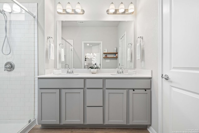 bathroom with vanity and an enclosed shower