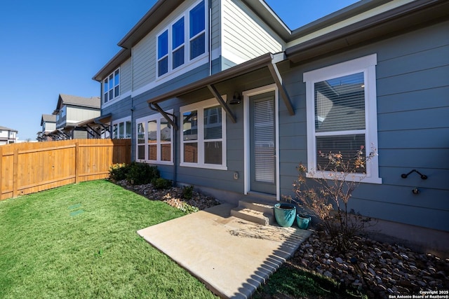 exterior space featuring a patio and a lawn