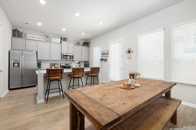 dining room with light hardwood / wood-style floors