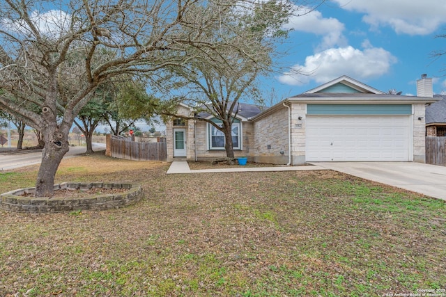 view of front of house featuring a garage and a front lawn