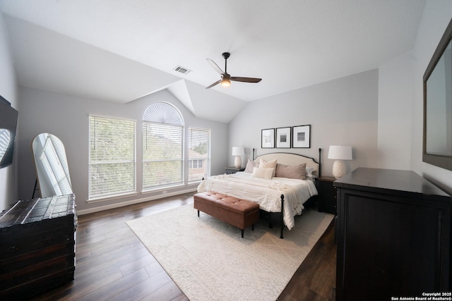 bedroom with dark wood-type flooring, ceiling fan, and lofted ceiling