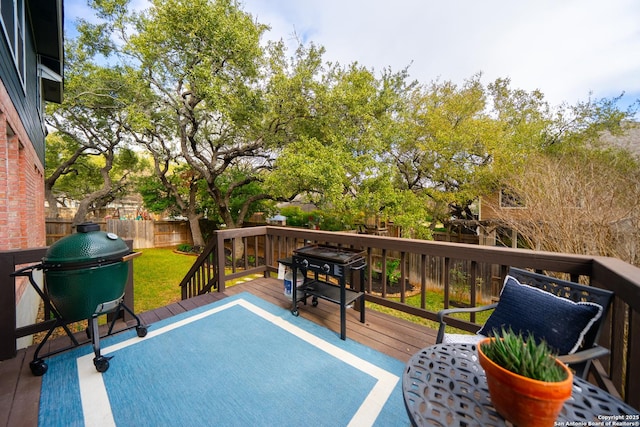 wooden deck featuring area for grilling