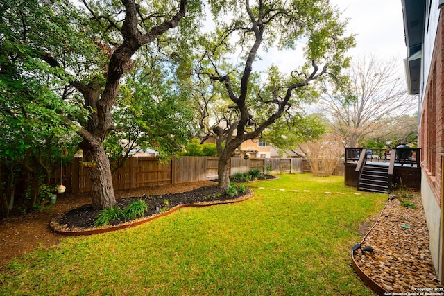 view of yard with a wooden deck