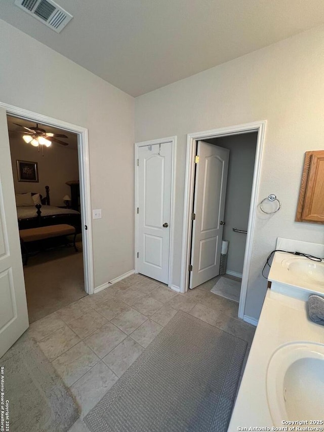 bathroom featuring vanity, tile patterned floors, and ceiling fan