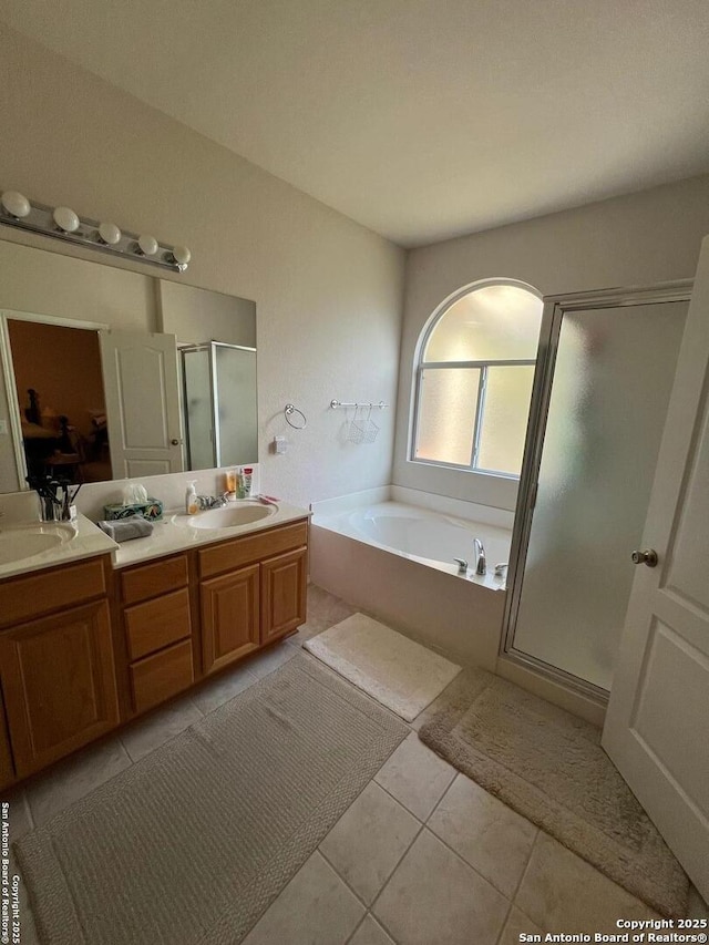 bathroom featuring vanity, separate shower and tub, and tile patterned floors