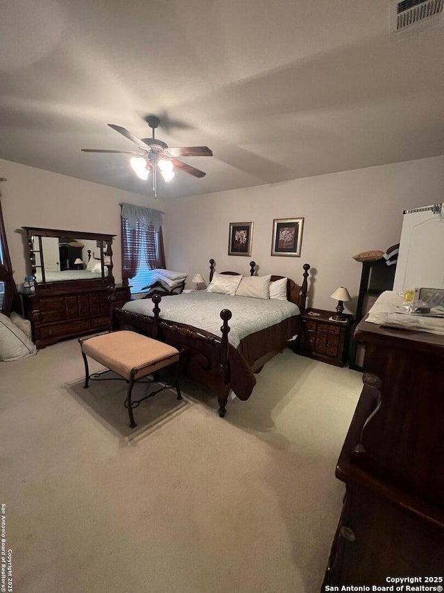 carpeted bedroom with ceiling fan