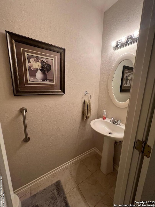 bathroom with tile patterned floors and sink