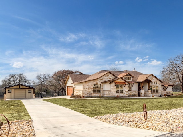 view of front of home featuring a garage and a front yard