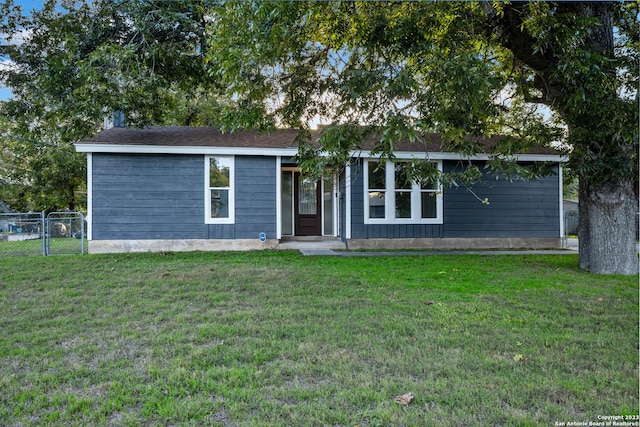 ranch-style house with a front yard