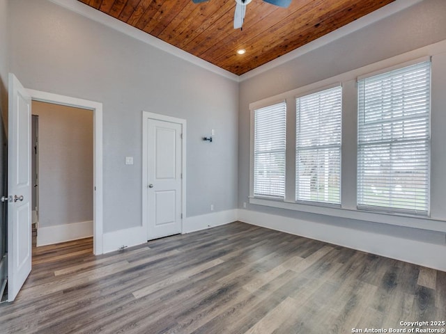 empty room with wood-type flooring, ceiling fan, and wood ceiling