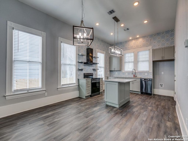 kitchen featuring gray cabinetry, a center island, black dishwasher, pendant lighting, and stainless steel electric stove