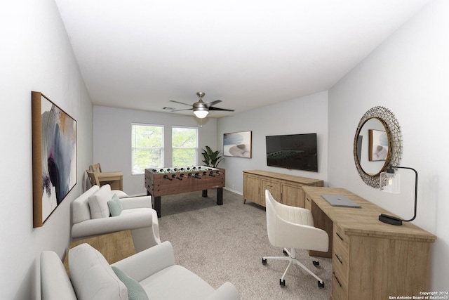 office area featuring light colored carpet and ceiling fan