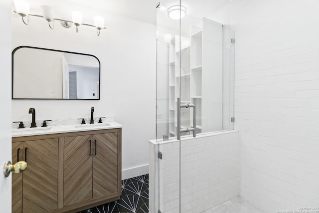 bathroom featuring vanity and an enclosed shower