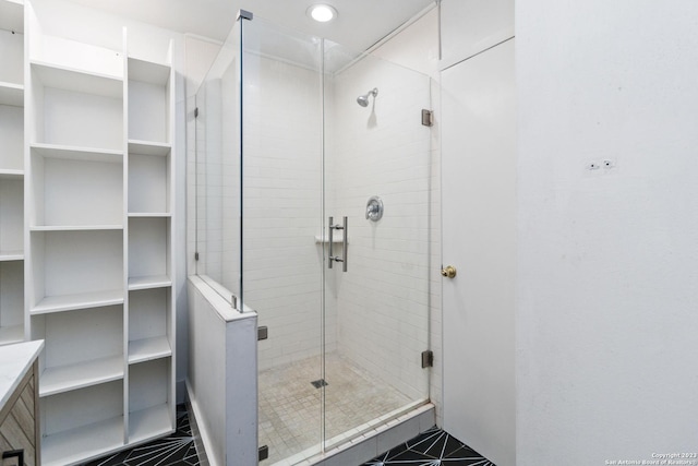 bathroom with tile patterned flooring and an enclosed shower