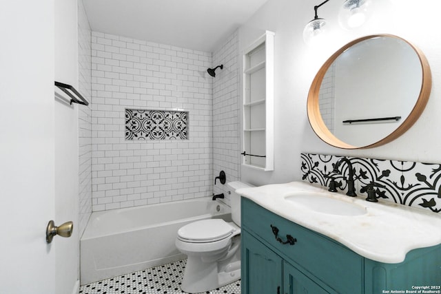 full bathroom with vanity, tile patterned flooring, tiled shower / bath combo, and toilet