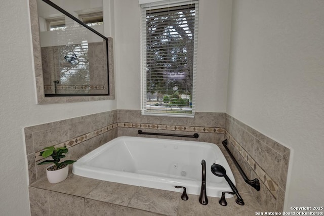 bathroom with tiled bath